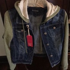 Denim jacket with green hood and sleeves